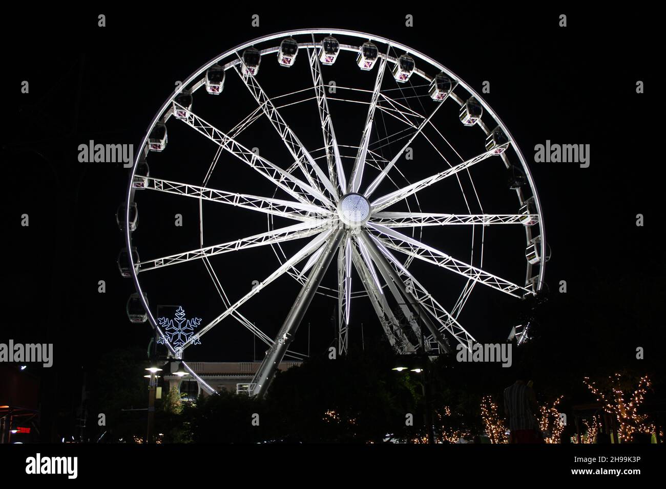 Cape Wheel, a large observation Ferris wheel illuminated at night in the Victoria and Albert Waterfront, Cape Town, Western Cape, South Africa Stock Photo