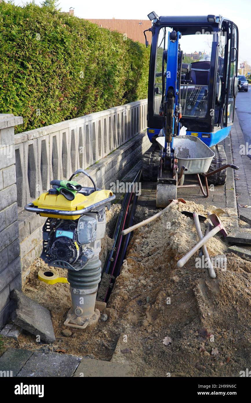 Fiber optic cable laying in the ground, buried cable for faster internet, Garbsen Berenbostel, Lower Saxony, Germany Stock Photo