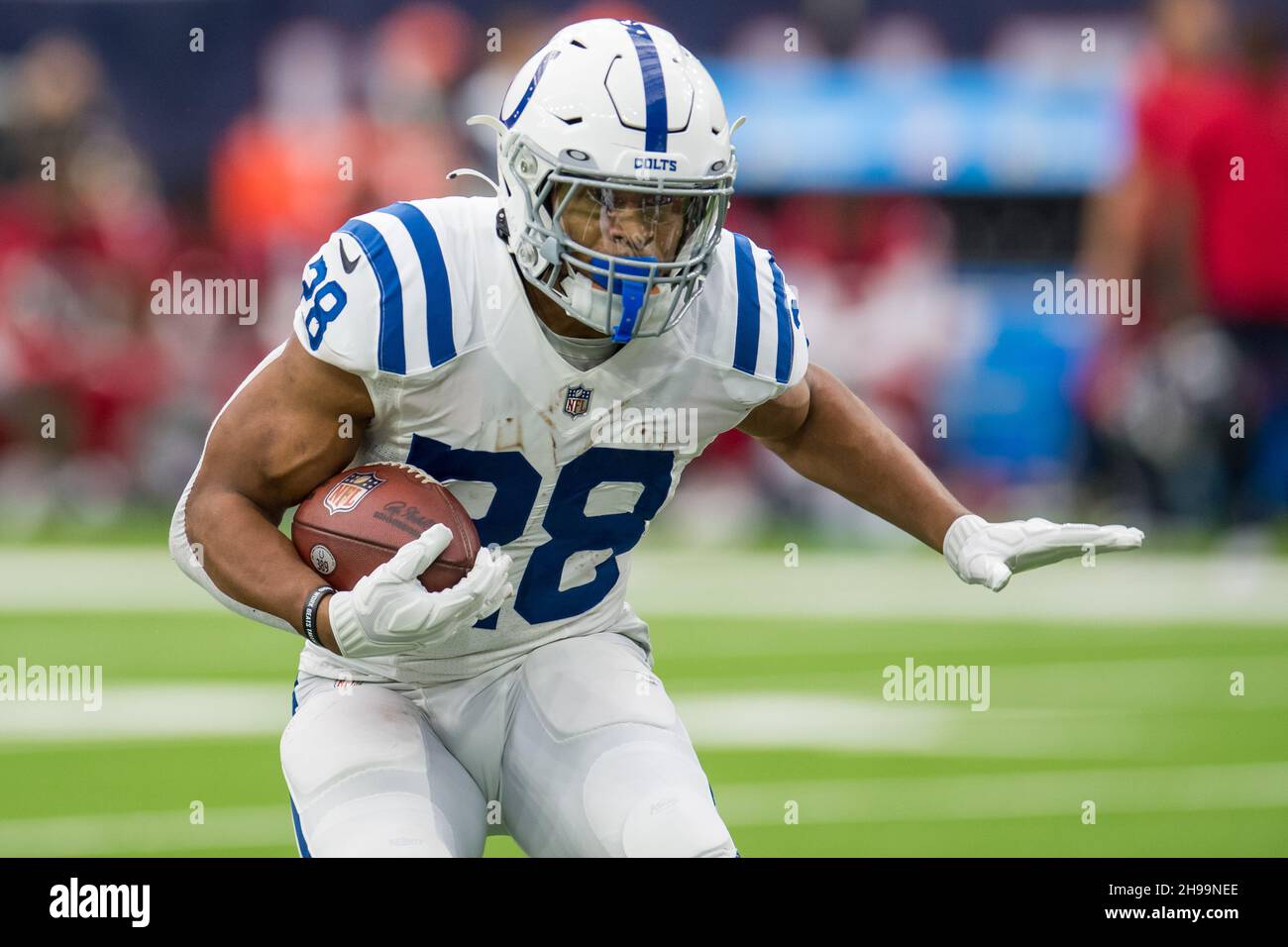 Houston, TX, USA. 5th Dec, 2021. Indianapolis Colts running back Jonathan  Taylor (28) carries the ball during the 1st quarter of an NFL football game  between the Indianapolis Colts and the Houston