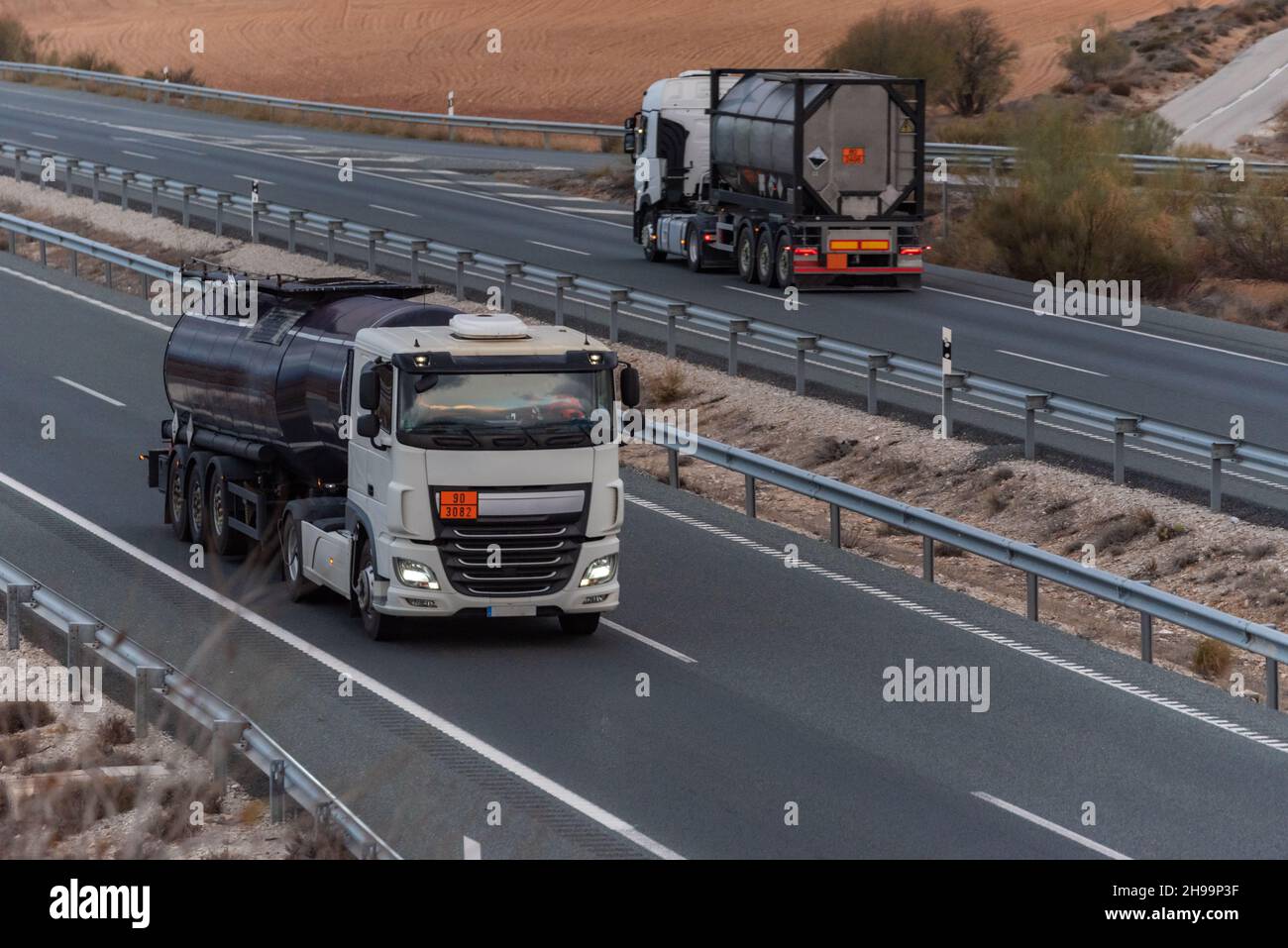 Dangerous goods tanker trucks traveling in opposite directions on the ...