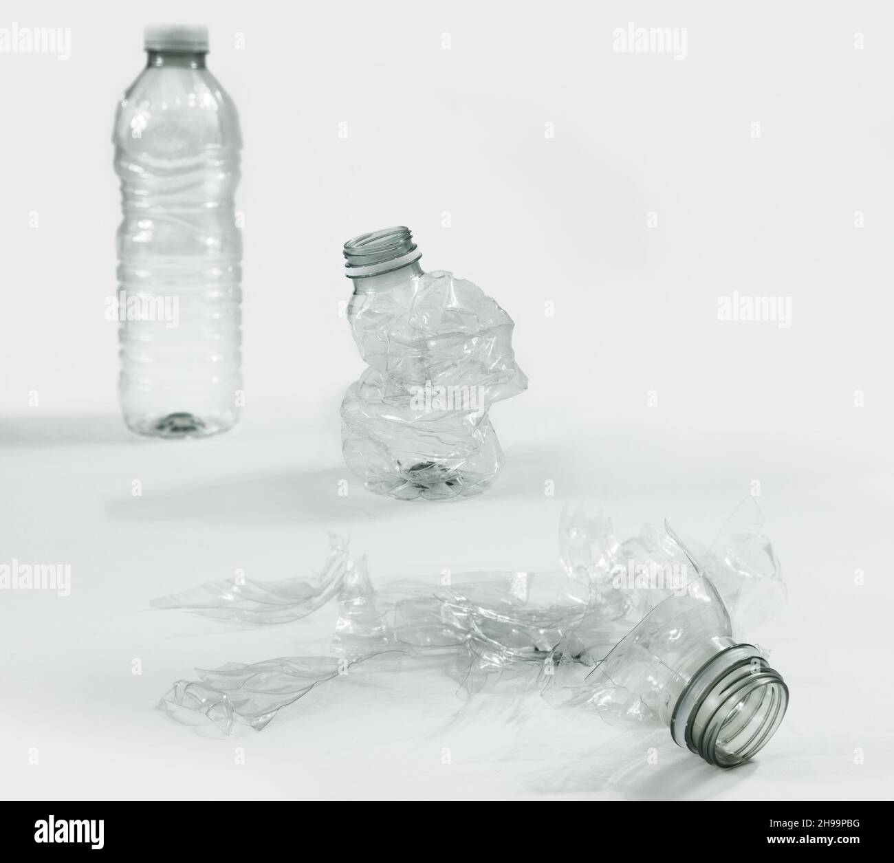 Plastic water bottle from the origin to the end of its life; ready for the recycling. Stock Photo