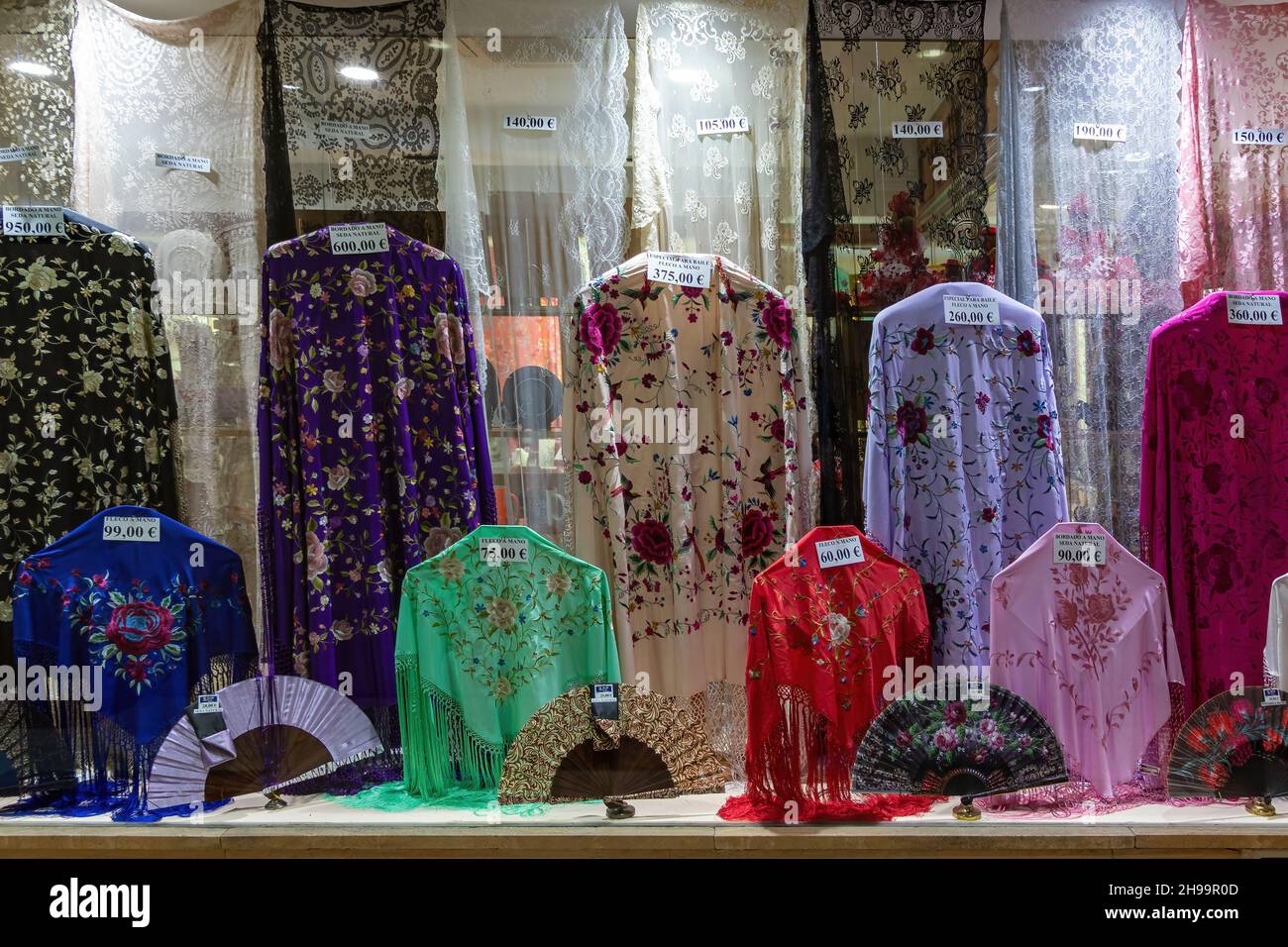 Seville, Spain - December 03,2021: Showcase with handmade manila shawls Stock Photo