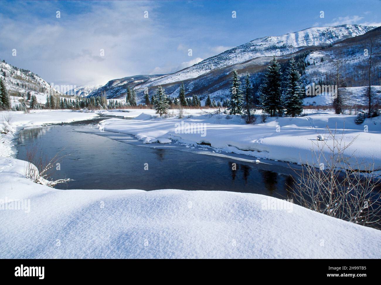 Pristine landscape of mountain valley and  Chrystal River of Colorado in winter snow Stock Photo