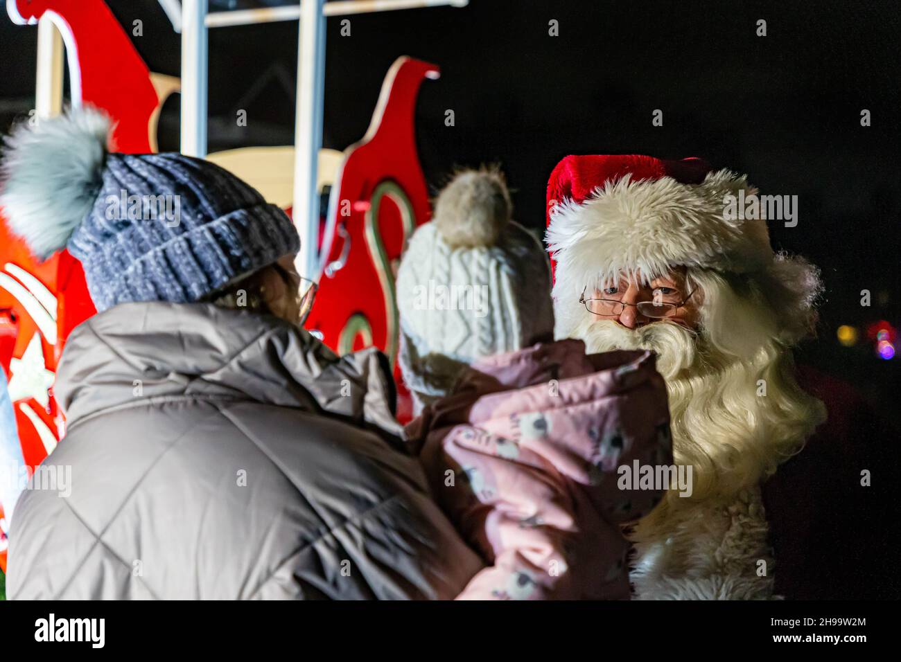 Warrington, Cheshire, UK. 05 December 2021 - Walton, near Warrington, Cheshire, has a gathering where Christmas Carols are sung and Father Christmas arrives to meet children and turn on the tree lights Credit: John Hopkins/Alamy Live News Stock Photo