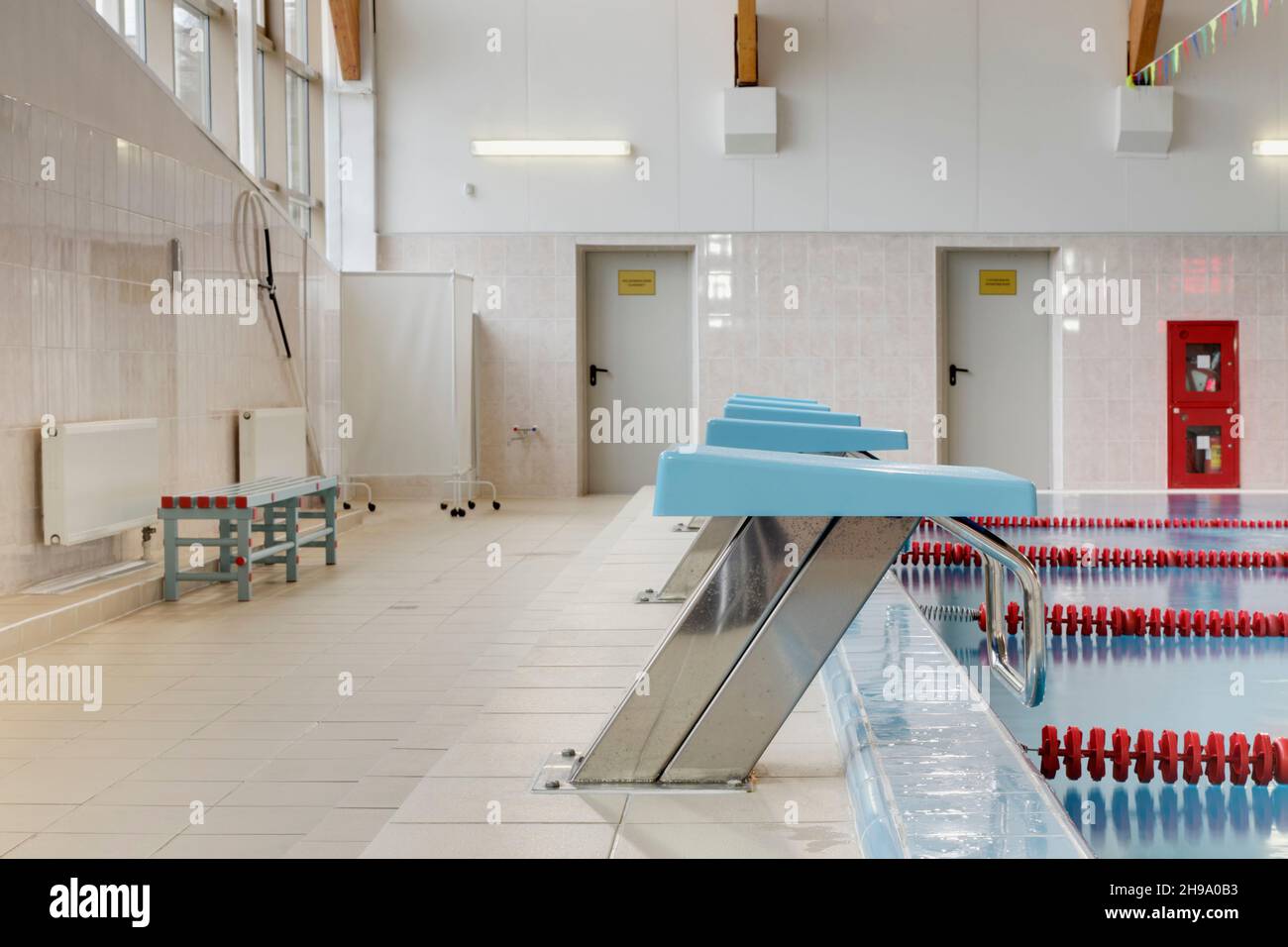 Heated indoor swimming pool, diving blocks, starting blocks for competition Stock Photo Alamy