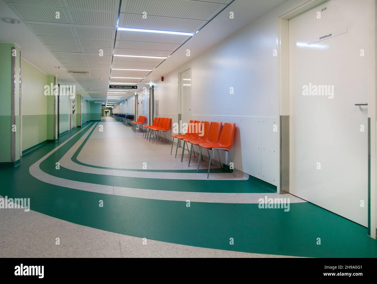 Corridor and waiting areas of a modern hospital with seating Stock Photo