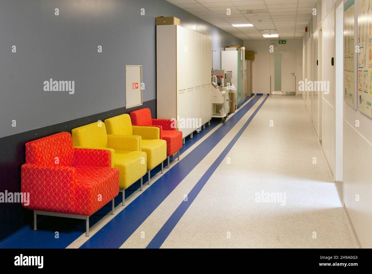 Corridor and waiting areas of a modern hospital with seating Stock Photo