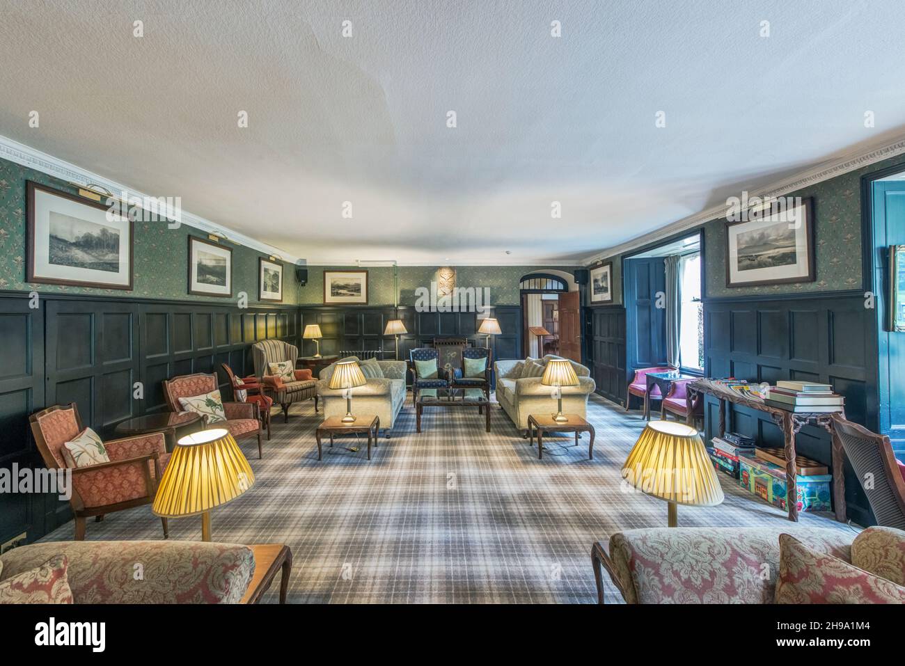 Hotel lounge with Scottish themed decoration, including tartan carpet. Stock Photo