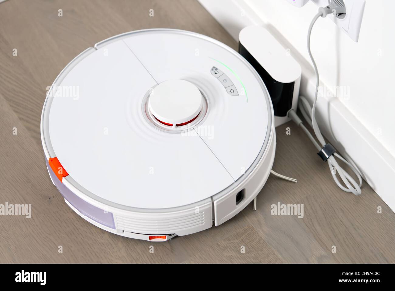 robot vacuum cleaner on charging dock station Stock Photo Alamy