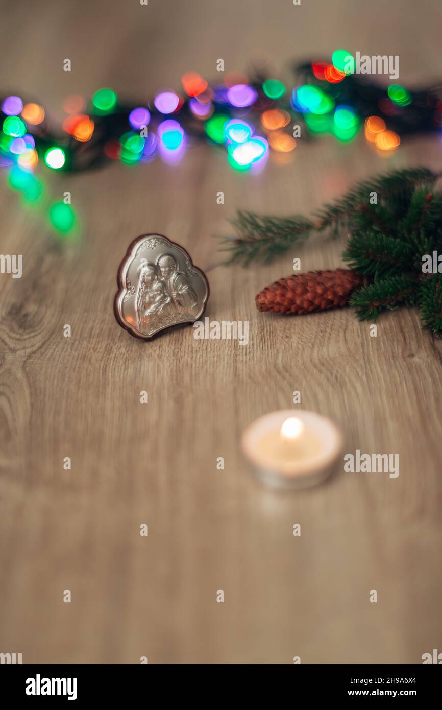 Christmas Composition of Church Icon on a Wooden Background With colorful Light Stock Photo