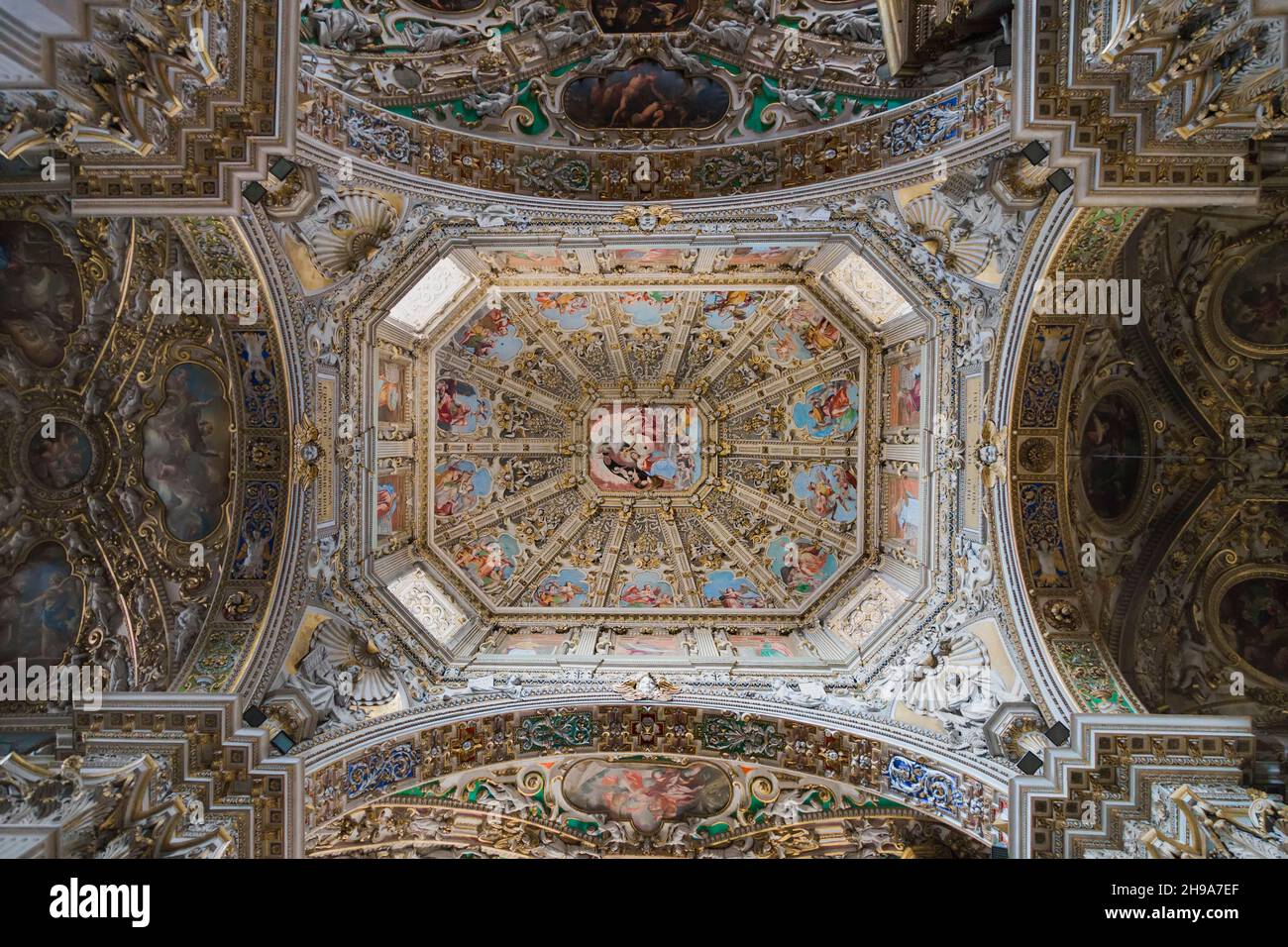A rich decorative ceiling painting and stucco in the Basilica of Santa Maria Maggiore. Brescia. Italy. Stock Photo