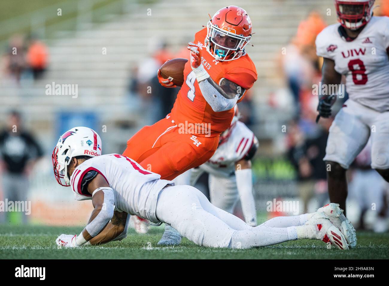 Huntsville, Texas, USA. 4th Dec, 2021. Houston Bearkats running back Ramon Jefferson (4) breaks away from Incarnate Word Cardinals defensive back Rashon Davis (7) in the second round of the 2021 NCAA Division I Football Championship Subdivision playoffs at Bowers Stadium in Huntsville, Texas. Sam Houston defeated UIW 49-42. Prentice C. James/CSM/Alamy Live News Stock Photo