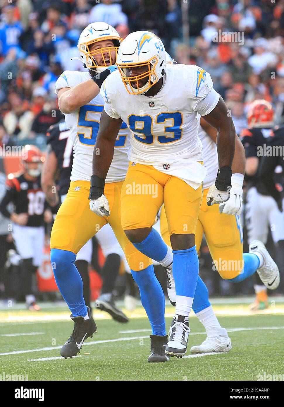 Cincinnati, Ohio, USA. 5th Dec, 2021. Los Angeles Chargers defensive tackle Justin Jones (93) is congratulated by defensive teammate inside linebacker Kyler Fackrell (52) at the NFL football game between the Los Angeles Chargers and the Cincinnati Bengals at Paul Brown Stadium in Cincinnati, Ohio. JP Waldron/Cal Sport Media/Alamy Live News Stock Photo