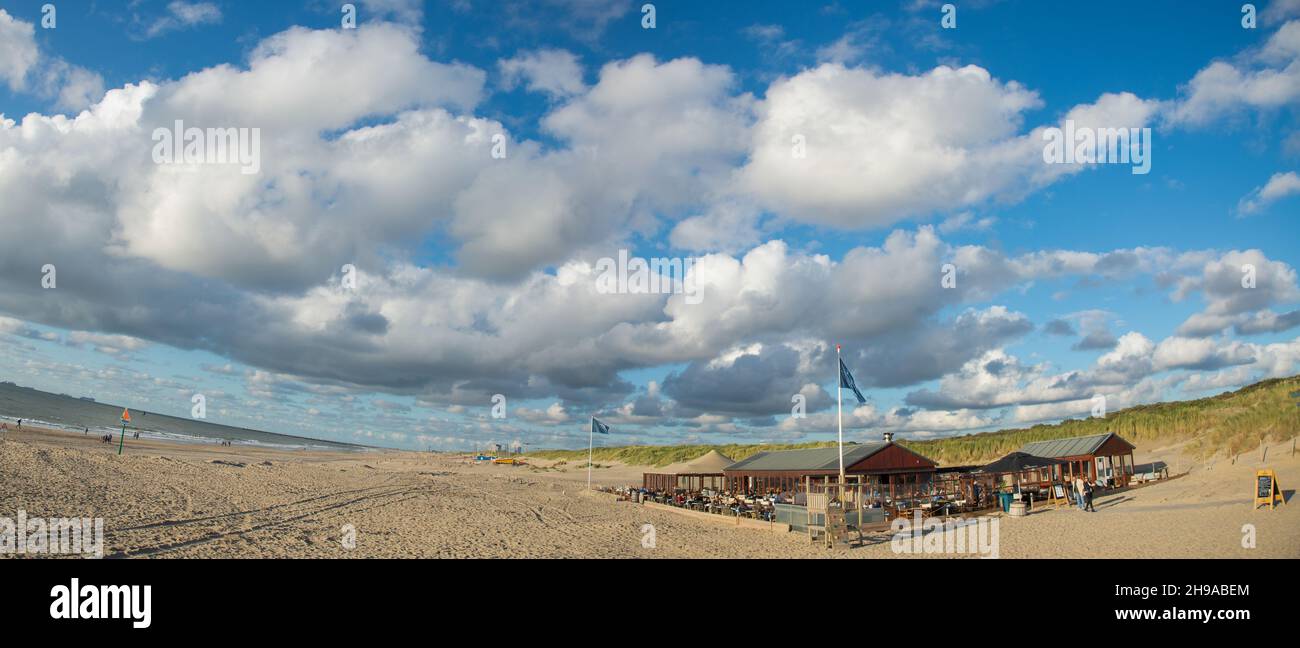 panoramic view of beach restaurant de Kwartel at Den Haag with cloudy blue sky Stock Photo
