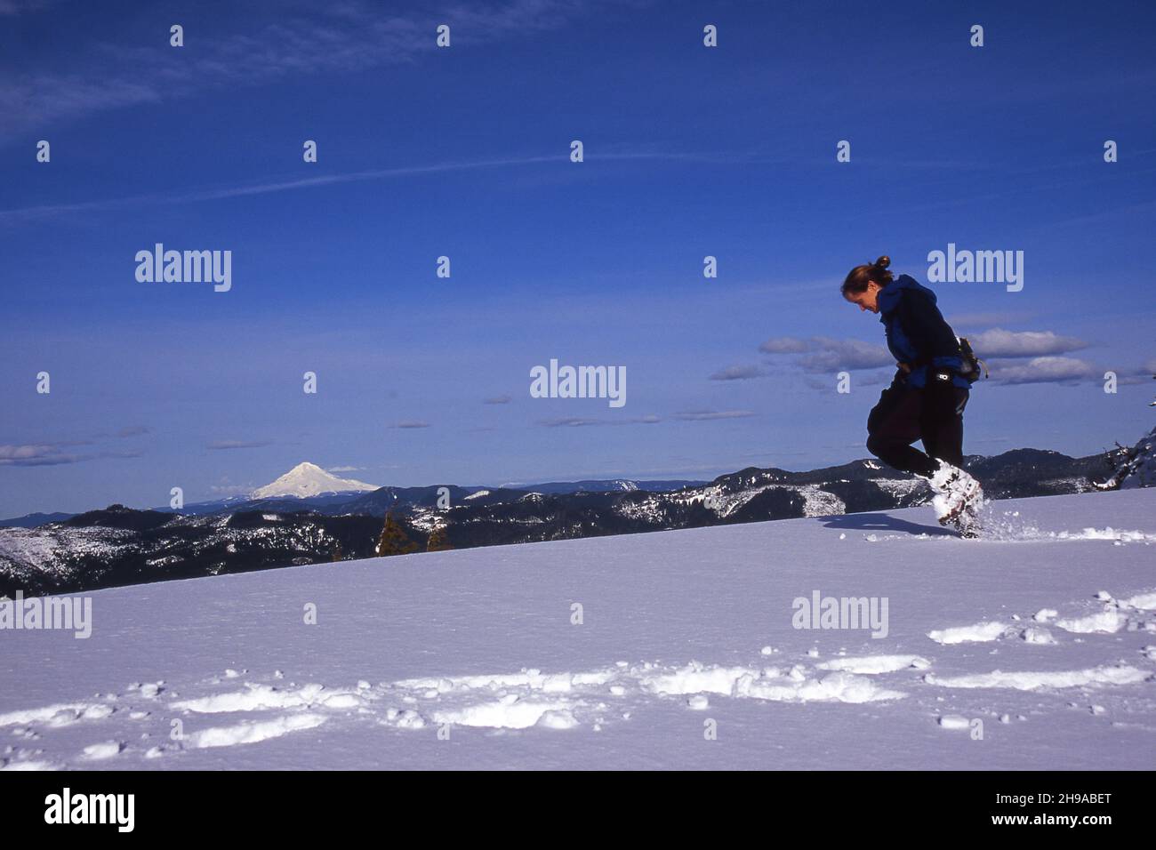 Woman walking through deep snow hi-res stock photography and images - Alamy