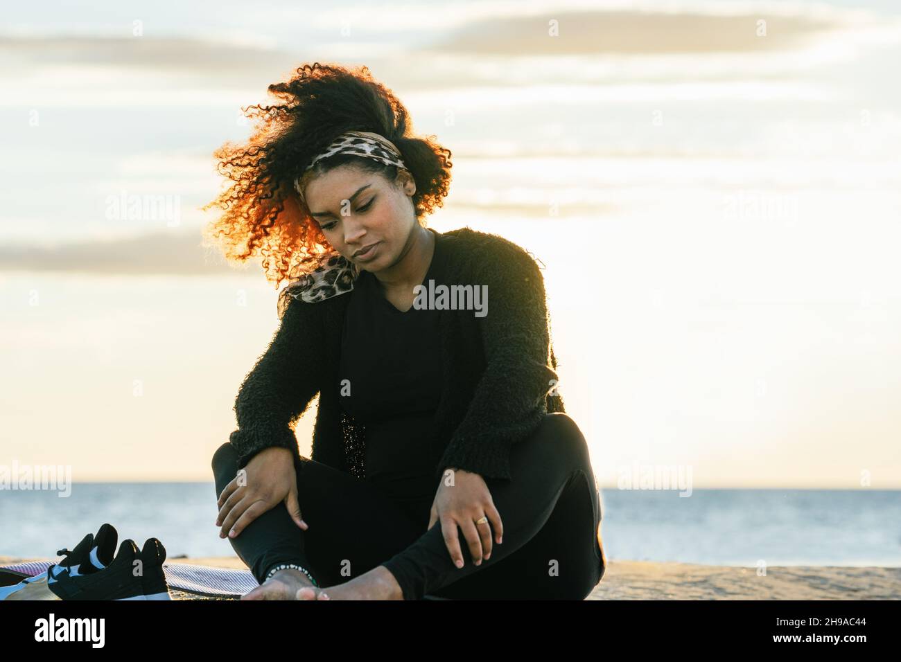 Woman alone beach massage hi-res stock photography and images - Alamy