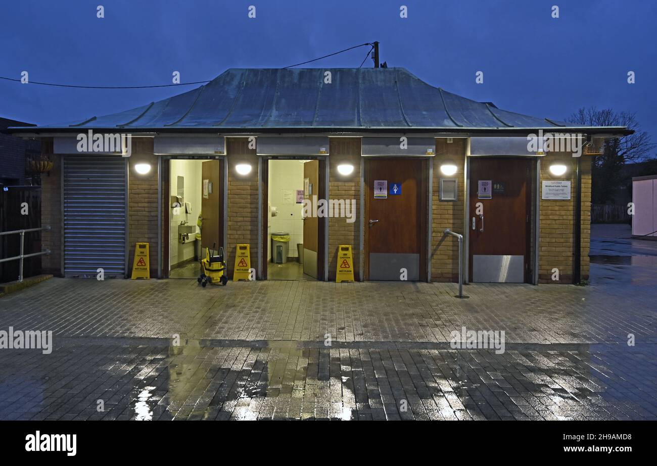 Basildon Council managed toilet block being serviced at Market Lane, Wickford, Essex. Lights on. Stock Photo