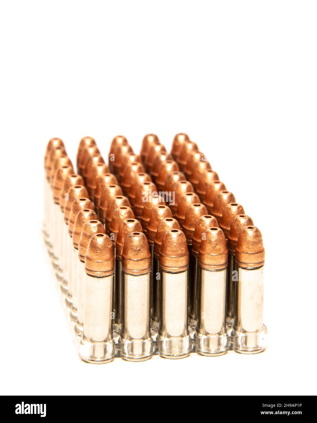 Image of a plastic tray of CCI Stinger .22 LR copper plated hollow point cartridges isolated on white Stock Photo