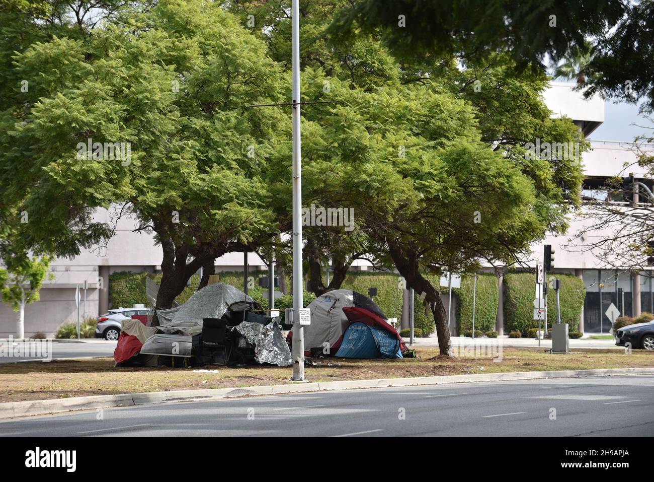 Beverly Hills, CA USA - October 22, 2021: Homeless encampment in Beverly Hills in front of an office building Stock Photo