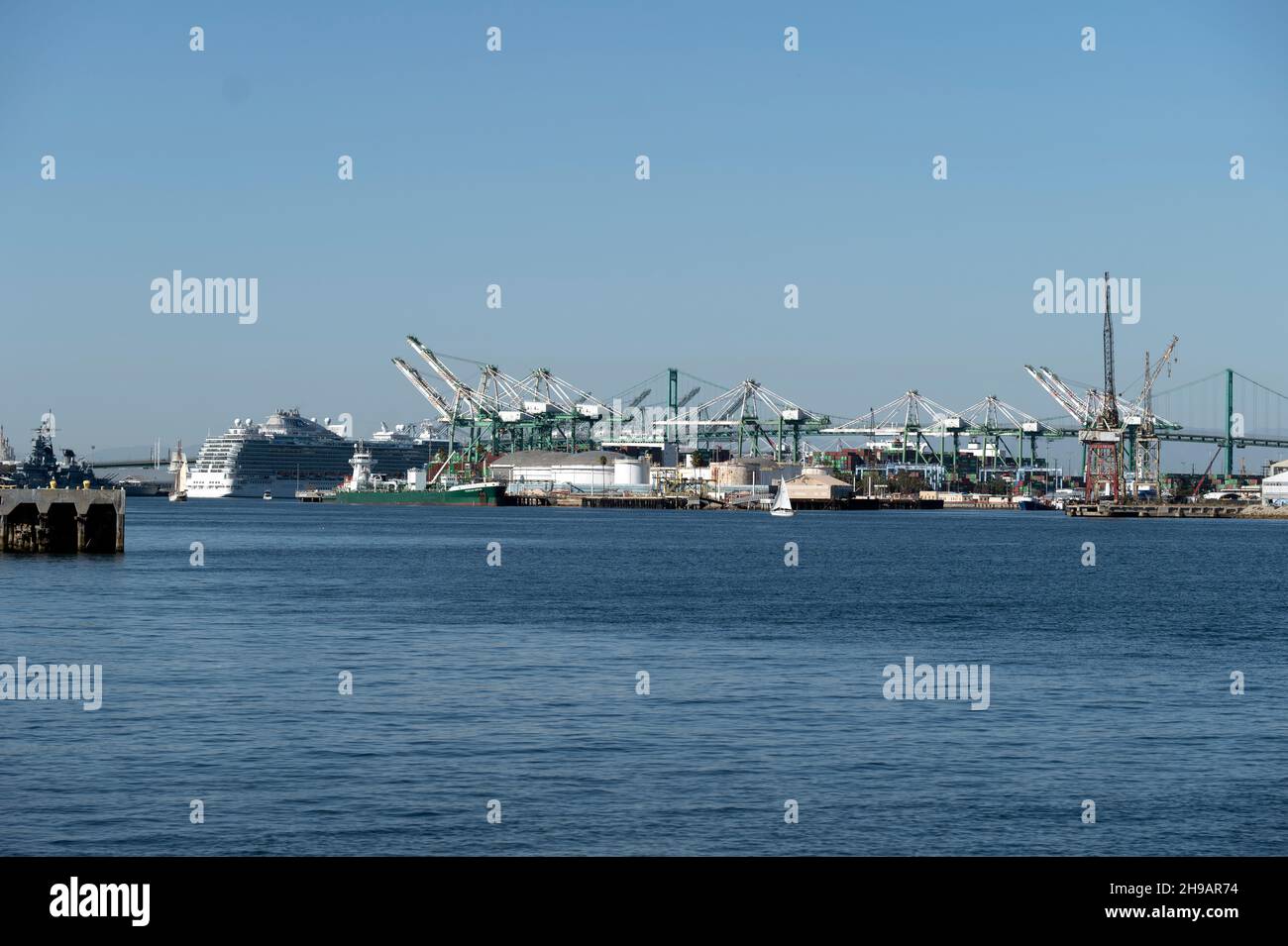 Cruise ship docked at the Port of Los Angeles near gantry cranes in the shipping yards Stock Photo