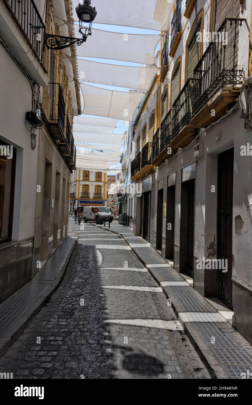 Covered street and old houses, Ecija, Seville Province, Andalusia Autonomous Community, Spain Stock Photo