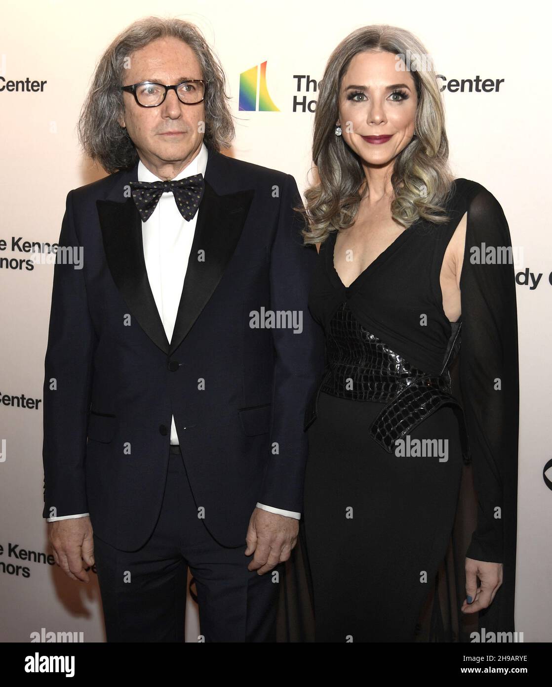 Washington, United States. 05th Dec, 2021. Lobbyist Heather Podesta (R) and filmmaker Stephen Kessler pose for photographers as they arrive for the 2021 Kennedy Center Honors gala evening in Washington, Sunday, December 5, 2021. The Honors are given annually to those in the performing arts for their lifetime of contributions to American culture. Photo by Mike Theiler/UPI Credit: UPI/Alamy Live News Stock Photo