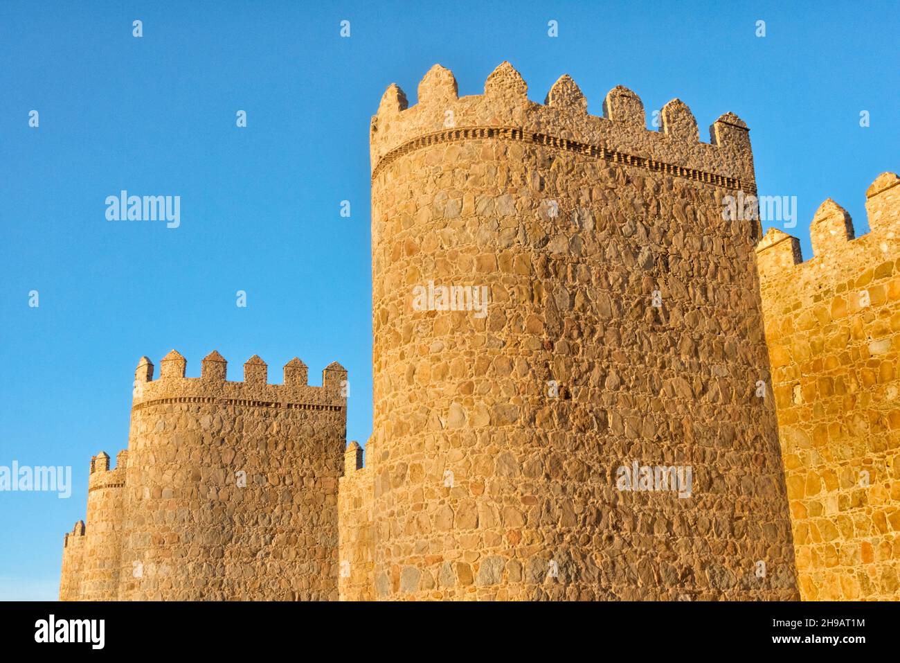 Sunset view of medieval town walls of Avila (UNESCO World Heritage site), Avila Province, Castile and Leon Autonomous Community, Spain Stock Photo