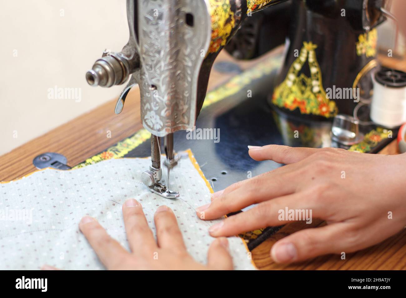 Retro style manual sewing machine working Stock Photo Alamy