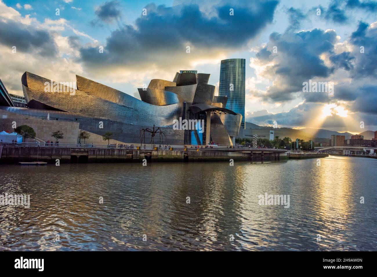 Guggenheim Museum Bilbao and high rise by Nervion River, Bilbao, Biscay Province, Basque County Autonomous Community, Spain Stock Photo