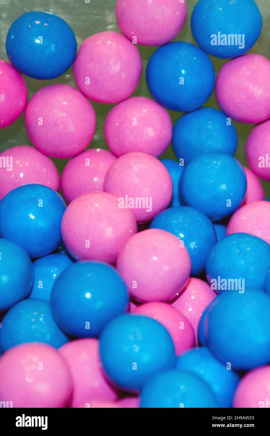 close up of pink and blue bubblegum at a birthday party for boy and girl twins Stock Photo