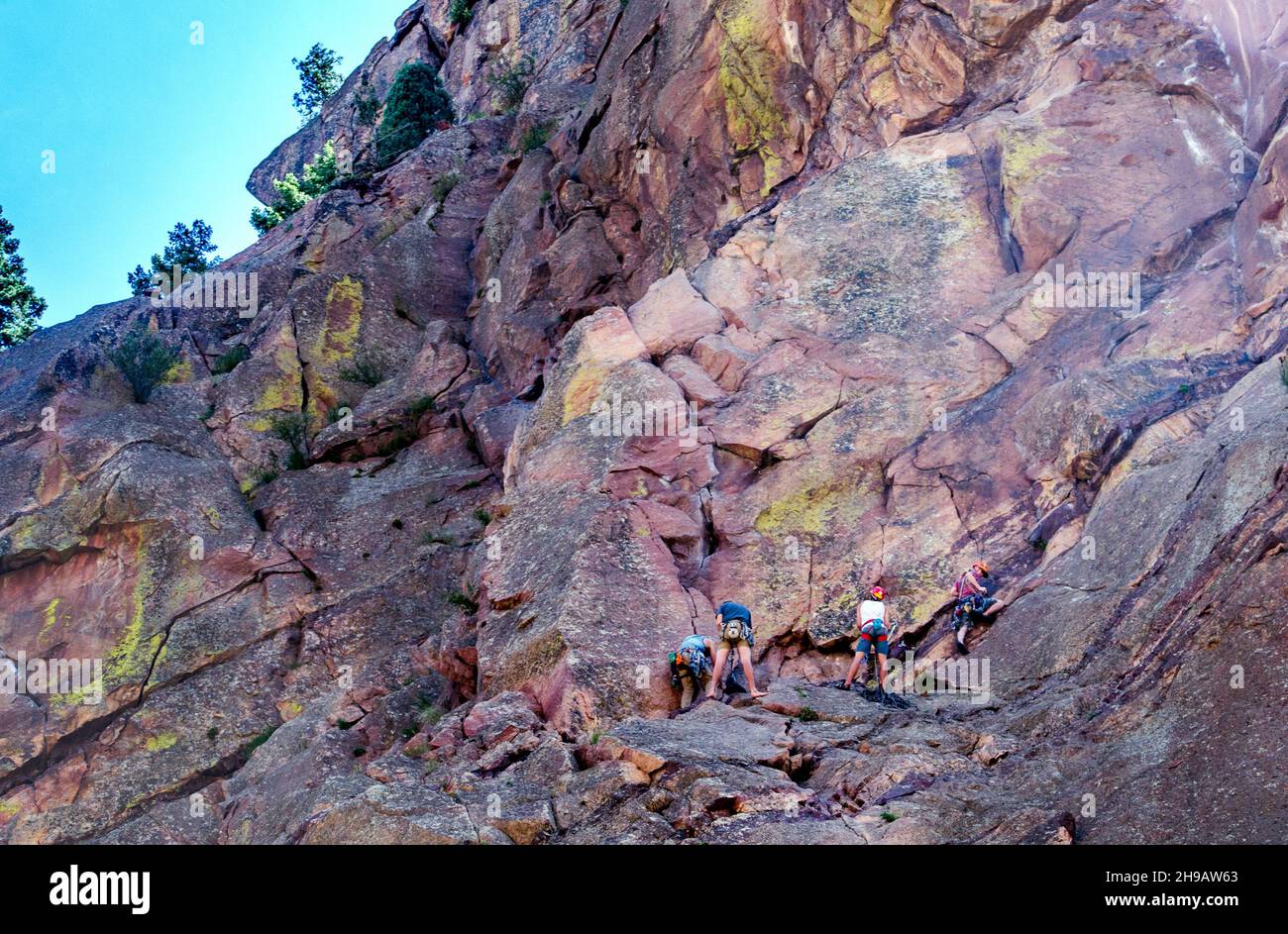 Eldorado springs colorado USA April 7 2019; group of rock climbers enjoy a beautiful day climbing in the colorado mountains Stock Photo