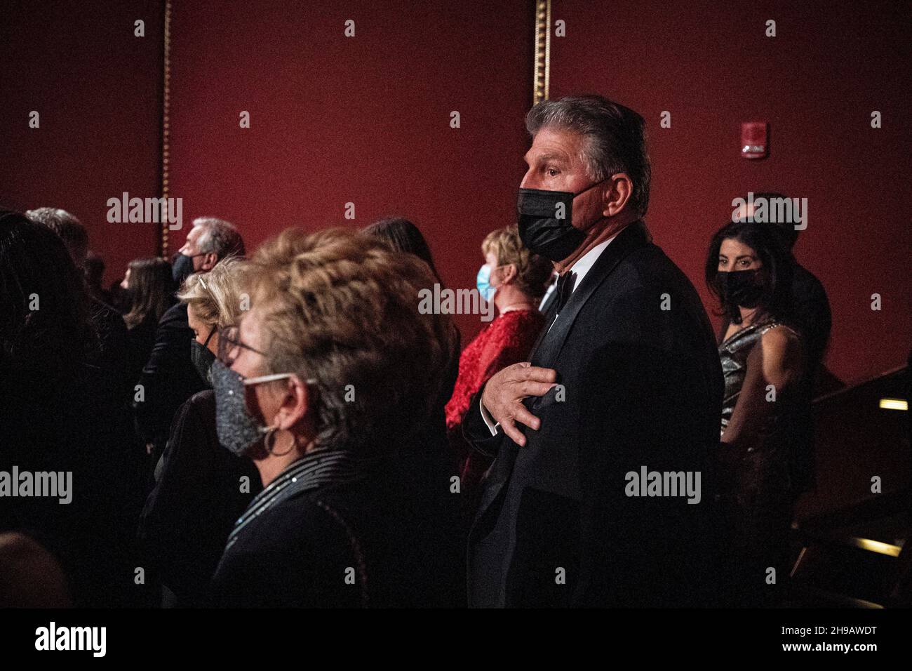 United States Senator Joe Manchin III (Democrat of West Virginia), stands for the National Anthem during the 44th Kennedy Center Honors at the John F. Kennedy Center for the Performing Arts in Washington, DC, U.S., on Sunday, Dec. 5, 2021. The 44th Honorees for lifetime artistic achievements include operatic bass-baritone Justino Diaz, Motown founder Berry Gordy, Saturday Night Live creator Lorne Michaels, actress Bette Midler, and singer-songwriter Joni Mitchell. Credit: Al Drago/Pool via CNP /MediaPunch Stock Photo