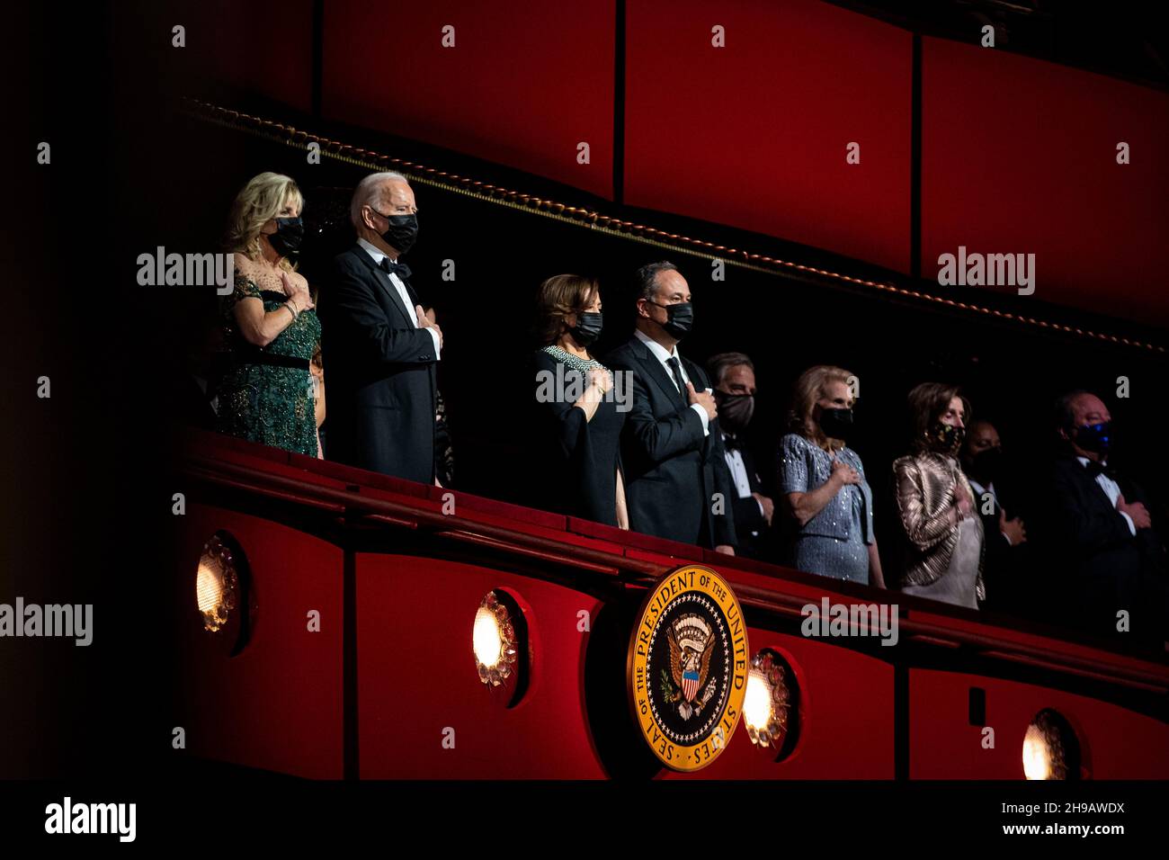 U.S. President Joe Biden, U.S. First Lady Jill Biden, U.S. Vice President Kamala Harris, and Second Gentleman Douglas Emhoff stand for the National Anthem during the 44th Kennedy Center Honors at the John F. Kennedy Center for the Performing Arts in Washington, DC, U.S., on Sunday, Dec. 5, 2021. The 44th Honorees for lifetime artistic achievements include operatic bass-baritone Justino Diaz, Motown founder Berry Gordy, Saturday Night Live creator Lorne Michaels, actress Bette Midler, and singer-songwriter Joni Mitchell. Credit: Al Drago/Pool via CNP /MediaPunch Stock Photo