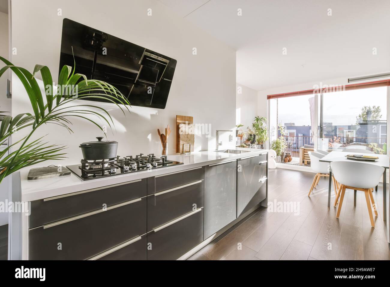 Attractive kitchen with stylish and modern black range hood Stock Photo