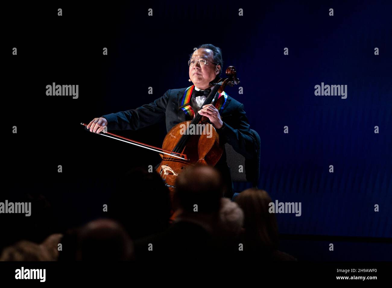 Cellist Yo-Yo Ma performs the National Anthem during the the 44th Kennedy Center Honors at the John F. Kennedy Center for the Performing Arts in Washington, DC, U.S., on Sunday, Dec. 5, 2021. The 44th Honorees for lifetime artistic achievements include operatic bass-baritone Justino Diaz, Motown founder Berry Gordy, Saturday Night Live creator Lorne Michaels, actress Bette Midler, and singer-songwriter Joni Mitchell. Credit: Al Drago/Pool via CNP /MediaPunch Stock Photo