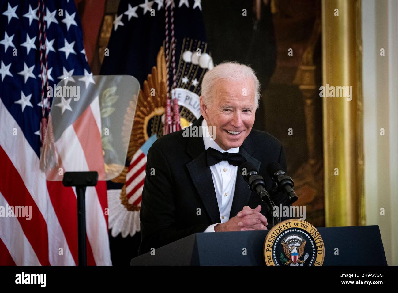Washington, DC, U.S., on Sunday, Dec. 5, 2021. U.S. President Joe Biden speaks during the the Kennedy Center Honorees Reception in the East Room of the White House in Washington, DC, U.S., on Sunday, Dec. 5, 2021. The John F. Kennedy Center for the Performing Arts 44th Honorees for lifetime artistic achievements include operatic bass-baritone Justino Diaz, Motown founder Berry Gordy, Saturday Night Live creator Lorne Michaels, actress Bette Midler, and singer-songwriter Joni Mitchell. Credit: Al Drago/Pool via CNP /MediaPunch Stock Photo