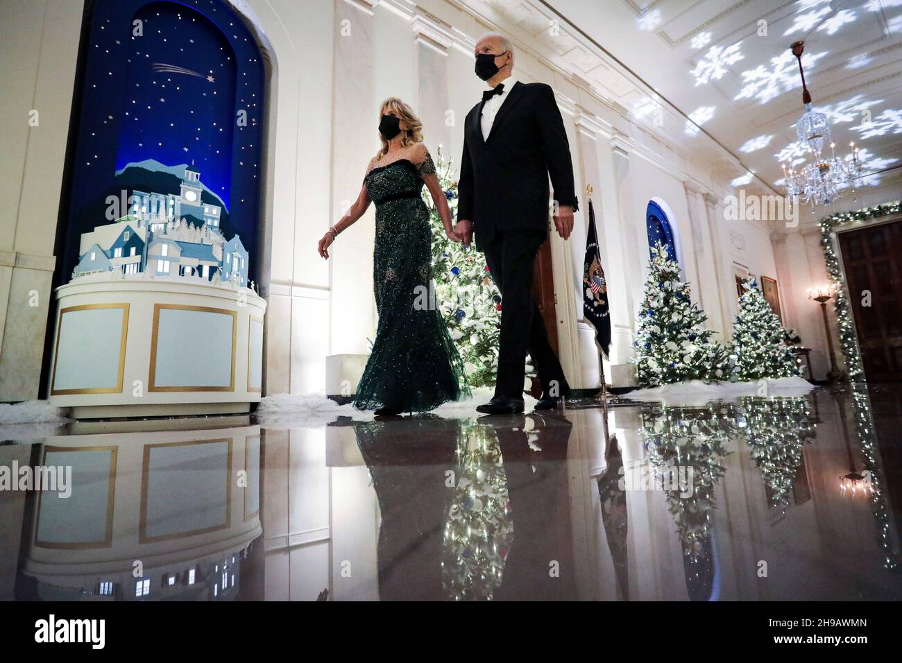 Washington, DC, U.S., on Sunday, Dec. 5, 2021. U.S. President Joe Biden and First Lady Dr. Jill Biden arrive in the Cross Hall during the Kennedy Center Honorees Reception at the White House in Washington, DC, U.S., on Sunday, Dec. 5, 2021. The John F. Kennedy Center for the Performing Arts 44th Honorees for lifetime artistic achievements include operatic bass-baritone Justino Diaz, Motown founder Berry Gordy, Saturday Night Live creator Lorne Michaels, actress Bette Midler, and singer-songwriter Joni Mitchell. Credit: Al Drago/Pool via CNP /MediaPunch Stock Photo