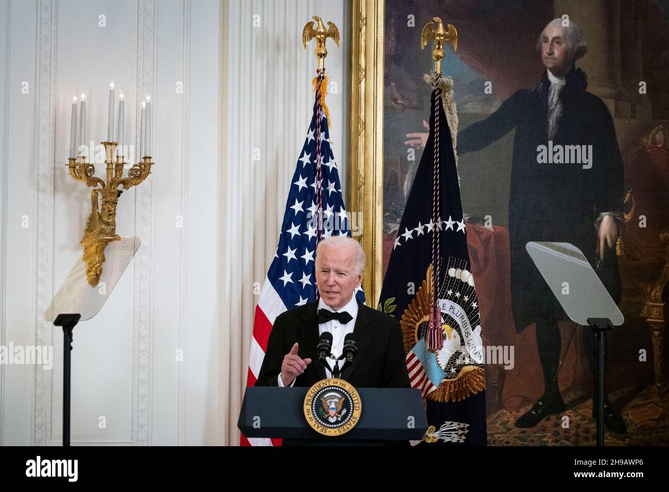 Washington, DC, U.S., on Sunday, Dec. 5, 2021. U.S. President Joe Biden speaks during the the Kennedy Center Honorees Reception in the East Room of the White House in Washington, DC, U.S., on Sunday, Dec. 5, 2021. The John F. Kennedy Center for the Performing Arts 44th Honorees for lifetime artistic achievements include operatic bass-baritone Justino Diaz, Motown founder Berry Gordy, Saturday Night Live creator Lorne Michaels, actress Bette Midler, and singer-songwriter Joni Mitchell. Credit: Al Drago/Pool via CNP /MediaPunch Stock Photo