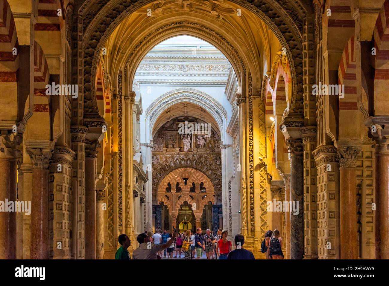Tourists inside Mezquita-Cathedral (Mosque-Cathedral or Great Mosque of Cordoba), Cordoba, Cordoba Province, Andalusia Autonomous Community, Spain Stock Photo