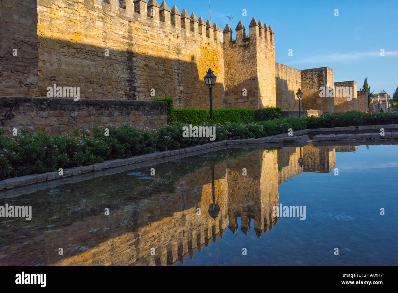 Roman walls of Cordoba with reflection in the moat, Cordoba, Andalusia Autonomous Community, Spain Stock Photo