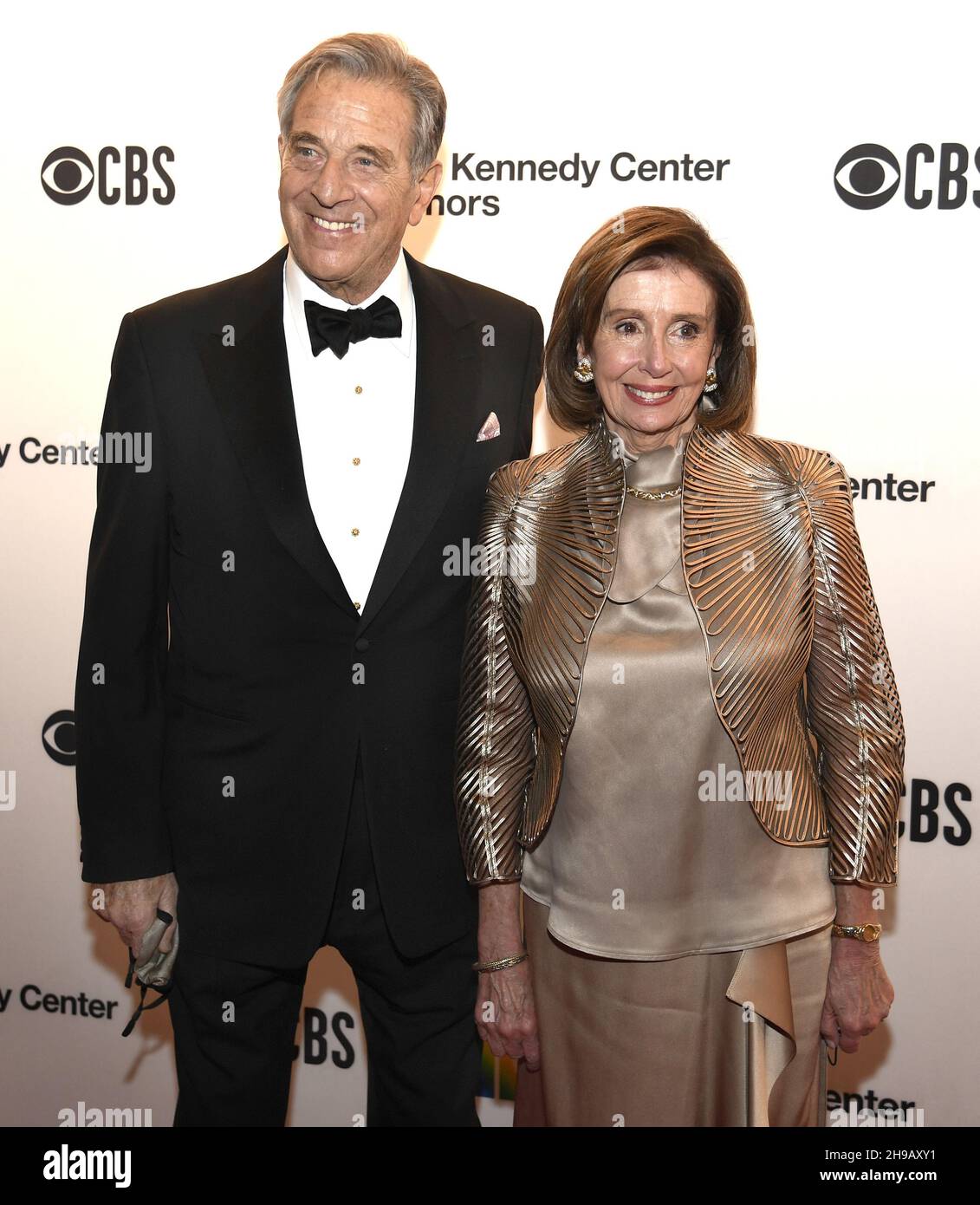 Washington, United States. 05th Dec, 2021. House Speaker Nancy Pelosi (D-CA) and husband Paul pose for photographers as they arrive for the 2021 Kennedy Center Honors gala evening in Washington, Sunday, December 5, 2021. The Honors are given annually to those in the performing arts for their lifetime of contributions to American culture. Photo by Mike Theiler/UPI Credit: UPI/Alamy Live News Stock Photo