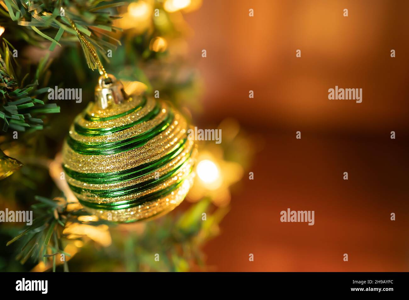 Christmas tree with decorations and lights background Stock Photo