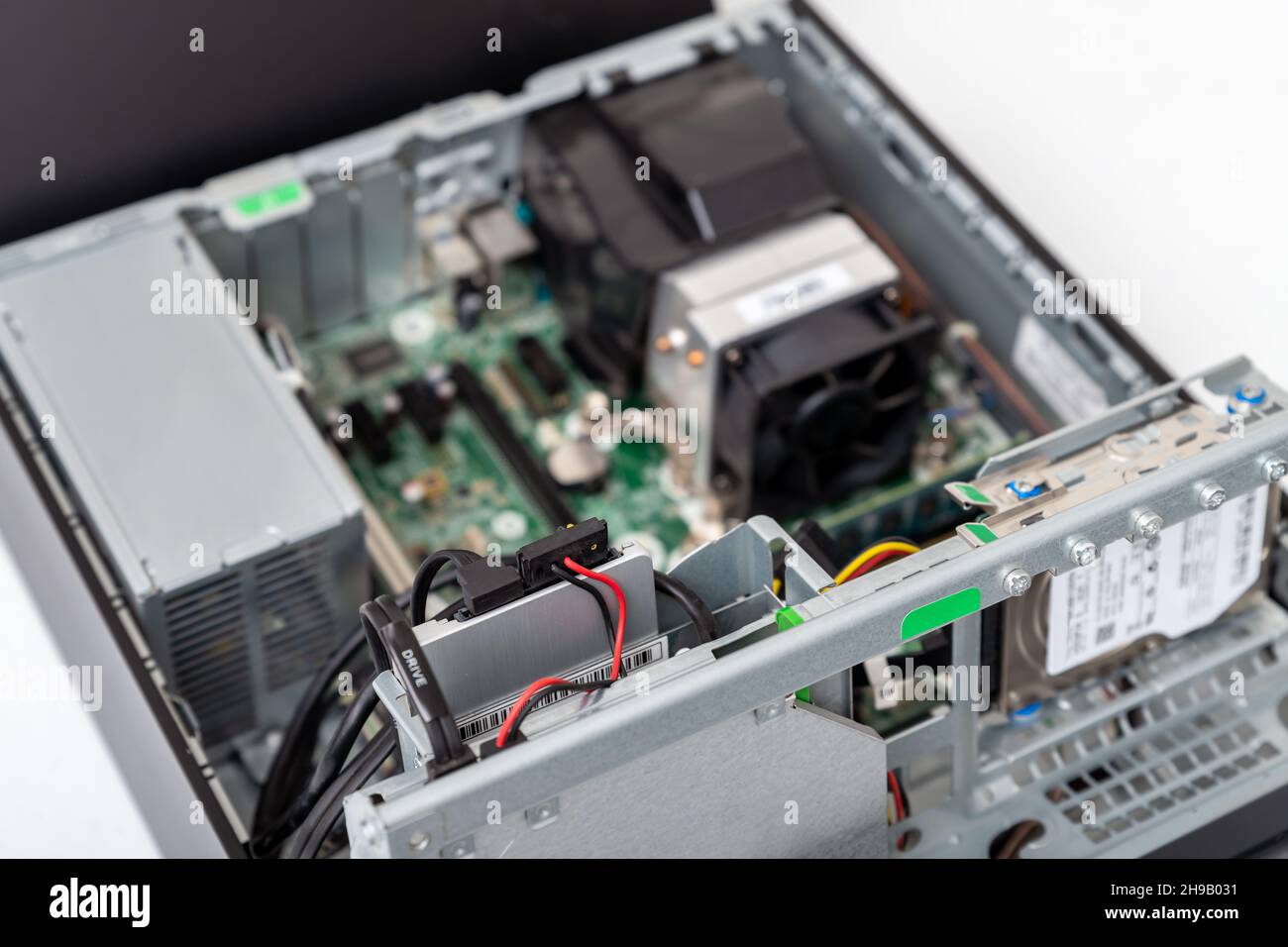 Closed-up view of SSD Hard disk drive with connectors inside of business desktop PC Stock Photo