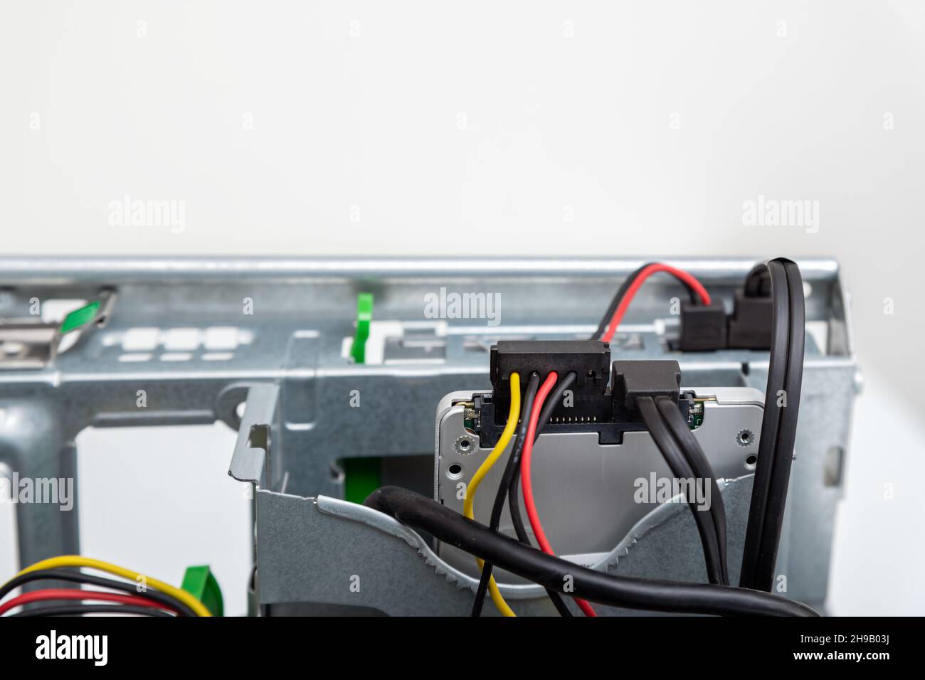 Closed-up view of SSD Hard disk drive with connectors inside of business desktop PC Stock Photo