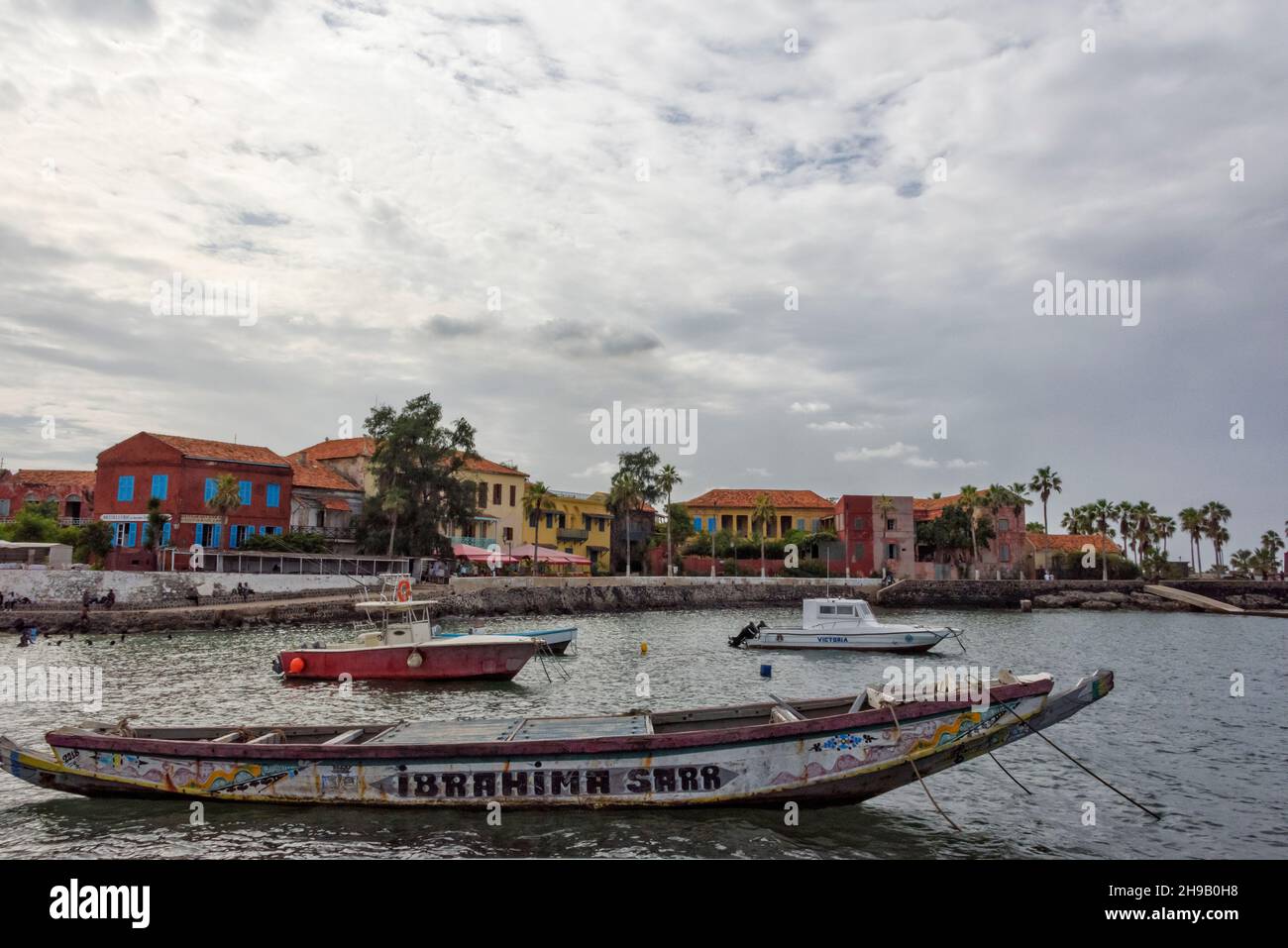 Fishing boats and colonial houses on Goree Island, UNESCO World Heritage site, Dakar, Senegal Stock Photo