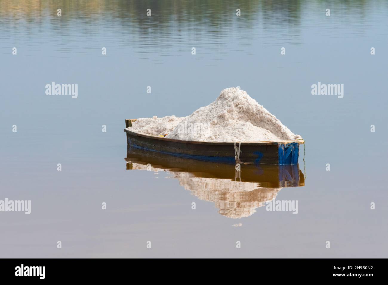 Boat with harvested salt on Lake Retba (Pink Lake), UNESCO World Heritage site, Cap Vert peninsula, Senegal Stock Photo