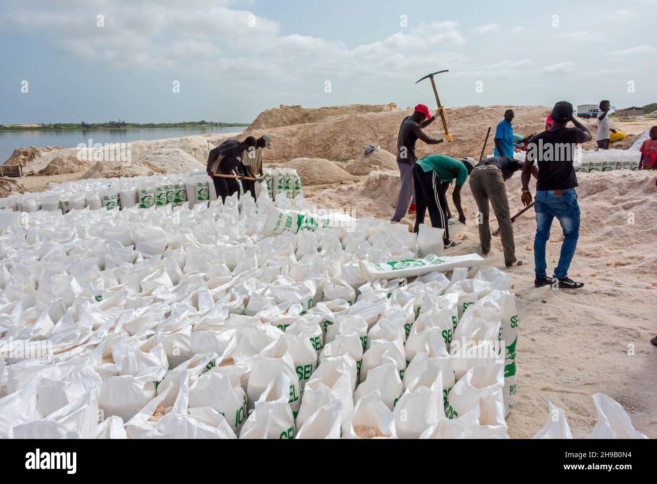 Harvested salt piles on Lake Retba (Pink Lake), UNESCO World Heritage site, Cap Vert peninsula, Senegal Stock Photo