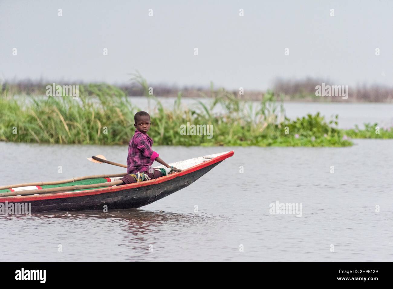 Rowing boat on Lake Nokoue, Benin Stock Photo