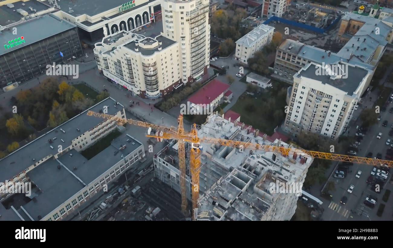 Aerial view of construction site with crane and building. Video. Top ...