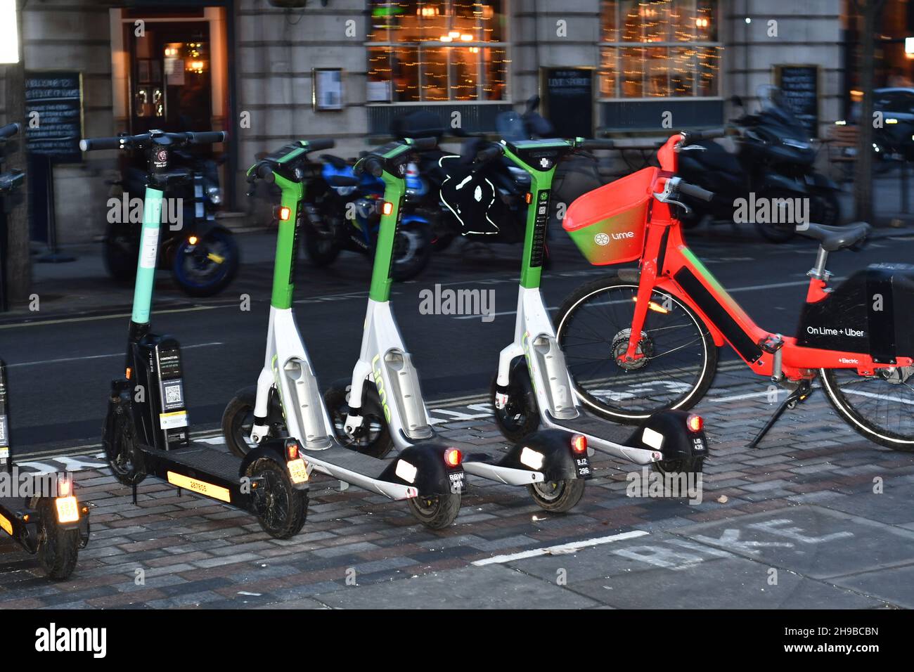 An E-Scooter and E bike station in London awaiting rental Stock Photo